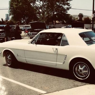 The 1964.5 Mustang is white in color.